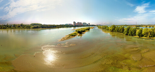 summer day over a sandbank near the island of the Kuban river near the city of Krasnodar - obrazy, fototapety, plakaty