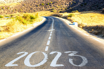 New Year Goals Concept : Empty asphalt road sunset and Happy New Year 2023 in Algeria