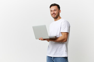 Happy tanned handsome man in basic t-shirt chatting with friends by laptop look at camera posing...