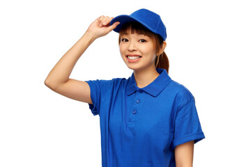 profession, job and people concept - happy smiling delivery woman in blue uniform over white background