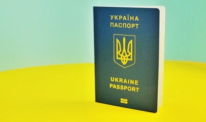 Ukrainian international biometric passport and bag for travel close up.Translation from Ukrainian Ukraine,passport