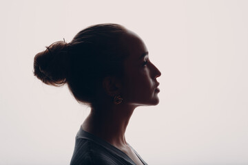 Young woman silhouette beautiful profile portrait isolated. - obrazy, fototapety, plakaty