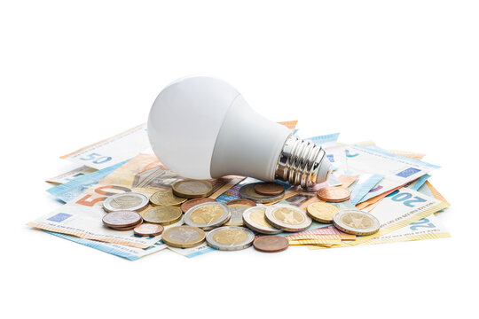 Light bulb and the euro money. Concept of increasing electricity prices.