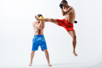 Two men boxers fighting muay thai boxing white background.