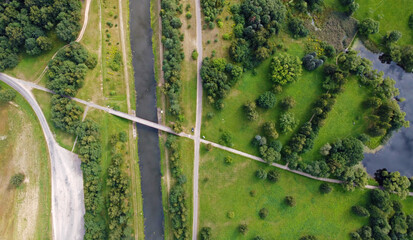 Aerial view of the big blue river with fields and forests