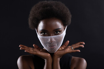 Portrait of african american dark skin woman fashion model wearing quarantine medical fishnet knitting face mask coarse mesh net. Covid-19 coronavirus protection unsafe dangerous concept.