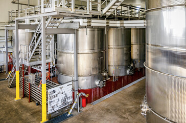 Stainless steel tanks of wine in a winery