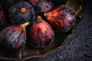 Figs in a silver dish on the table. Close up. High quality photo