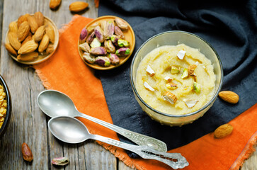 Lentils halwa. Indian sweets in a glass on a wood background