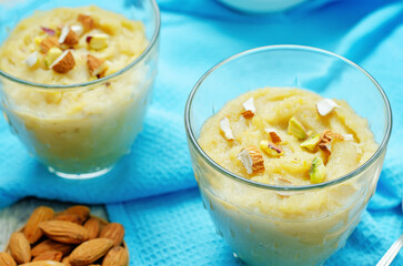 Lentils halwa. Indian sweets in a glass on a wood background