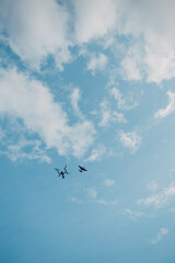 Fototapeta premium Big quadcopter drone and rc airplane model on aerial flight and filming.