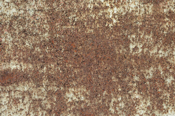 a rusty wall, in the photo a metal wall covered with rust and old paint