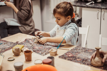 Fototapeta na wymiar children's hands sculpts clay crafts pottery school