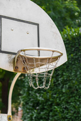 Chain basket of street basketball backboard close-up on nature background outdoors
