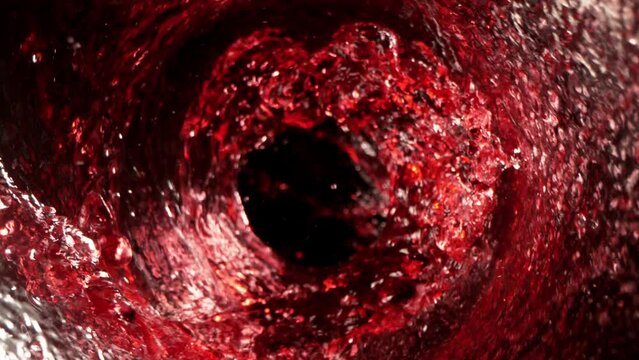 Super Slow Motion Shot of Red Wine Whirl Isolated on Black Background at 1000fps.