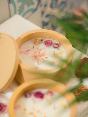 Soy candle in a concrete, plaster candlestick, decor interior. Home decoration with a burning scented candle. Gypsum, concrete products.