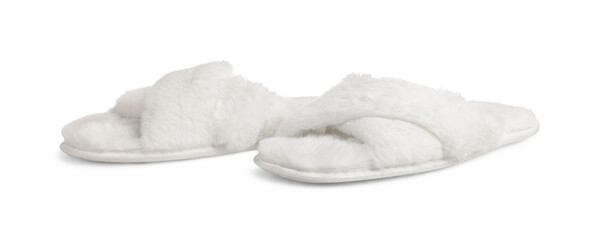 Pair of soft fluffy slippers on white background
