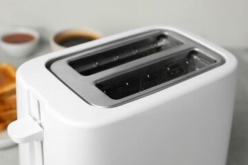 Closeup view of toaster indoors. Kitchen appliance