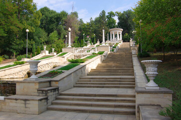 Moldova, Kishinev.  View of a white gazebo with columns and steps leading up.