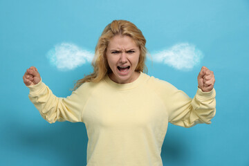 Aggressive woman with steam coming out of her ears on light blue background