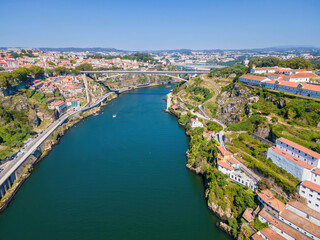 Fototapeta na wymiar A scenic view of Porto and the Douro River with two bridges: Infante Dom Henrique and D. Maria Pia