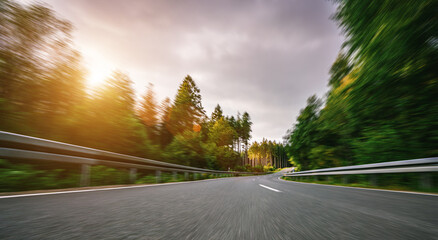 highway into Silent Forest in spring with beautiful bright sun rays