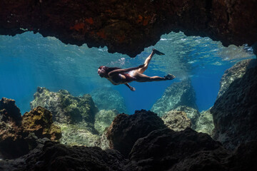 freediver girl in the cave. underwater shoot.