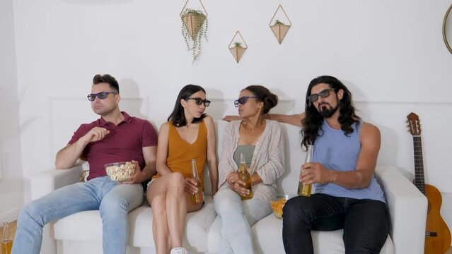 two guys and 2 girls look in 3d glasses and react to what they see
