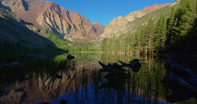 Parker lake in the eastern sierra Nevada mountains at sunrise reflecting on water 
