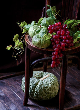 autumn composition with wine and green pumpkins and grapes. Concept of Thanksgiving