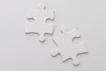 Two puzzle pieces - blank, studio shot on white