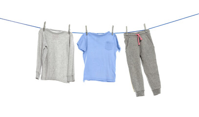 Different clothes drying on washing line against white background