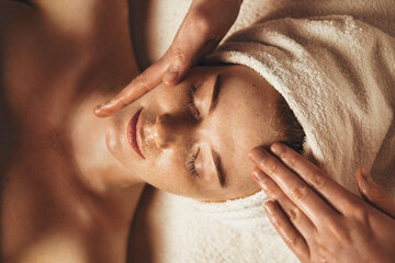 Close-up of young woman getting spa massage treatment at beauty spa salon. Cosmetology beauty skin...