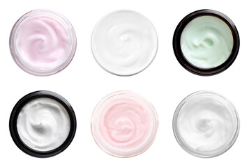 Set of different jars with hand creams on white background, top view