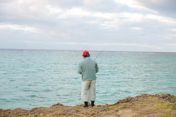 Fototapeta na wymiar an old man fishing