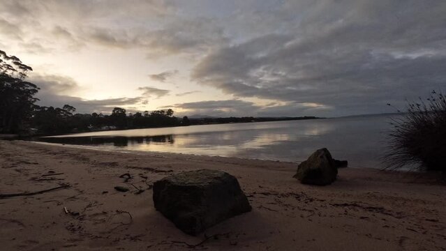 Early morning sunrise time-lapse in Strahan on the West Coast of Tasmania, Australia