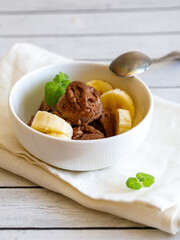Healthy raw vegan banana and chocolate ice cream (icecream or nicecream) - healthy vegetarian diet, vegan raw fruit organic delicious dessert, dairy free, gluten free summer dessert. Vertical