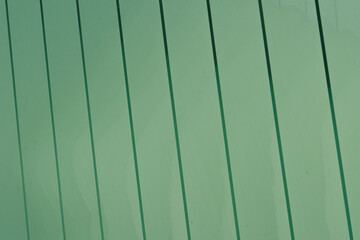 Obraz premium Green glass panes stacked forming a pattern