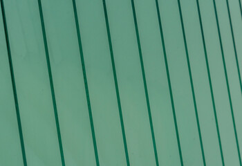 Green glass panes stacked forming a pattern