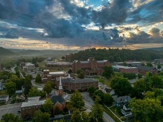 Aerial view of Mansfield University and town in rural Pennsylvania typical small town America in the rust belt with dramatic morning sky - obrazy, fototapety, plakaty