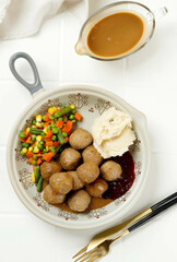 Meatballs with Mushroom Sauce, Mashed Potato, Stirfry Vegetable, and Jam.