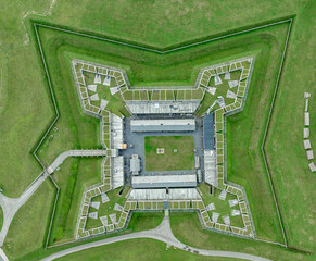 Aerial view of star shaped reconstructed 
Fort Stanwix in Rome New York with four angled wooden bastions and cannons - obrazy, fototapety, plakaty
