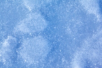 Texture of winter ice surface. Blue natural ice background