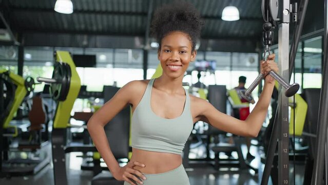 Portrait of African sport girl in sportwear exercising in fitness club