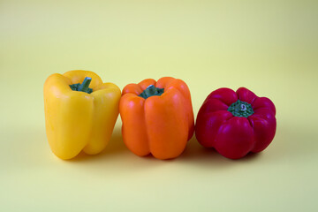 three yellow, orange, and red peppers organic food vegetarian diet fresh snack