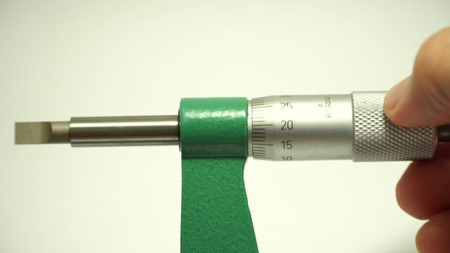blade micrometer engineer's hand has a non-rotating spindle with a flat blade for the contact point,Measuring instrument industry concept