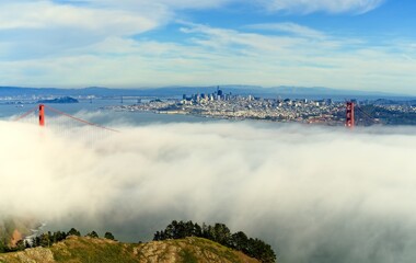Towers of Golden Gate Bridge poke through the fog
