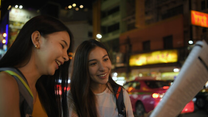 Travel concept of 4k Resolution. Asian women are using maps to find places together in the city.