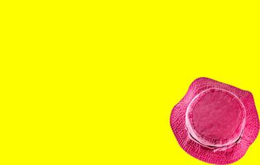 A pink red hat isolated on colored background