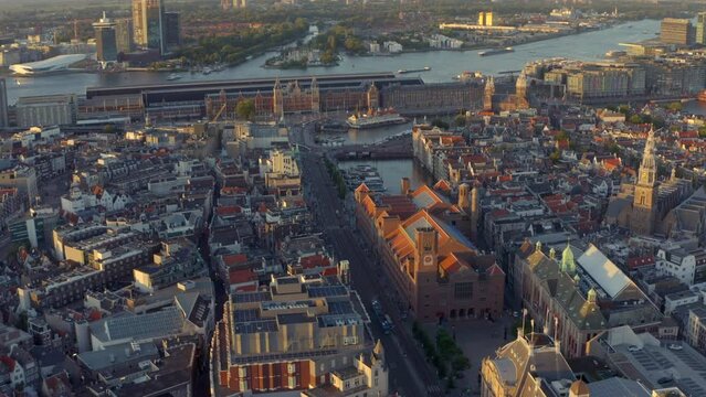 Circling drone shot over Damrak Amsterdam Central station